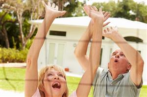 Seniors playing volleyball outside